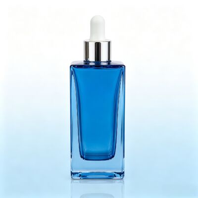 Flacon compte-gouttes en verre transparent bleu, flacon d'emballage de sérum cosmétique à base épaisse et carrée avec compte-gouttes en caoutchouc blanc