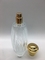 Les bouteilles de parfum 100ml vides grandes de luxe sertissent par replis le pulvérisateur avec le chapeau rond d'or